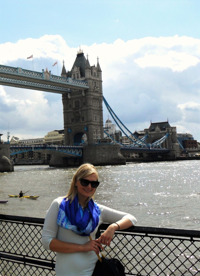 Posing for typical tourist photo in front of Tower Bridge.